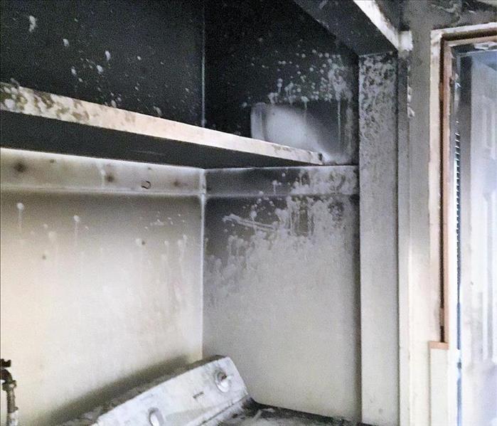 kitchen with black soot and fire damage 