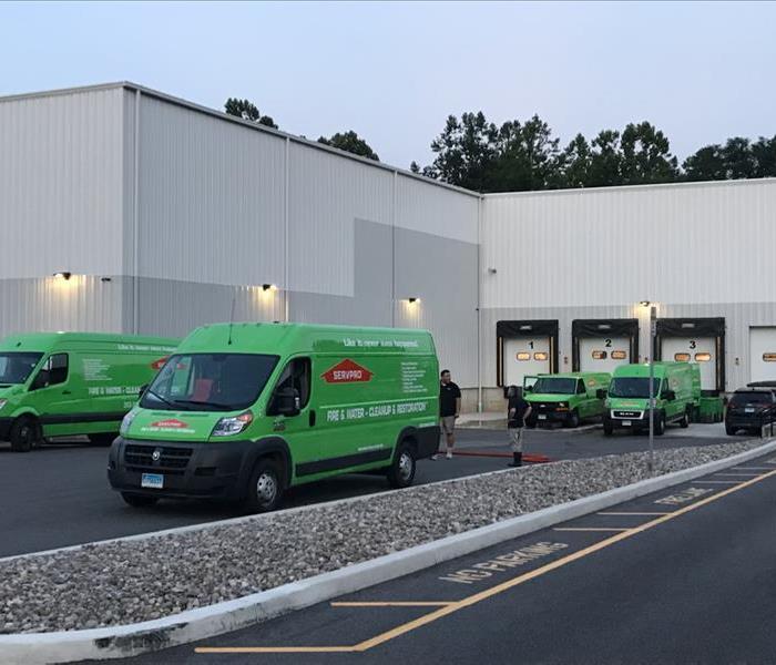 Servpro trucks in a parking lot